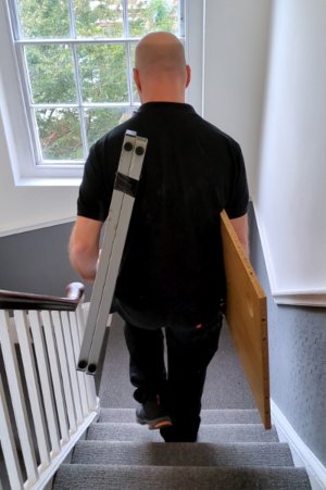 desk-carry-downstairs-300x451 bedroom air conditioning