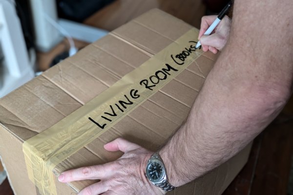 packing-service-living-room-box-600x400 office removals in progress